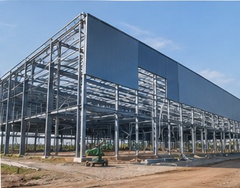 Pre-engineered metal building exterior with primary frames and metal wall cladding